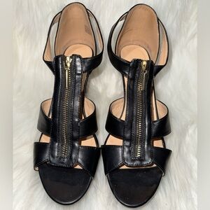 XOXO Black and Gold Stiletto Sandals with Strappy Design